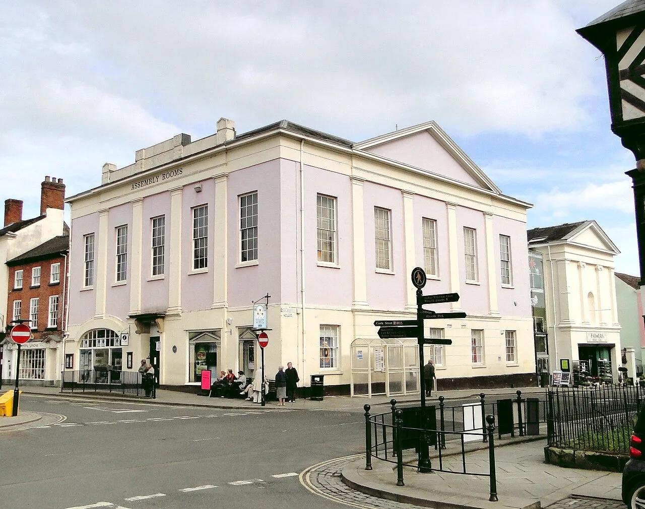The pale exterior of Ludlow Assembly Rooms beside the market square