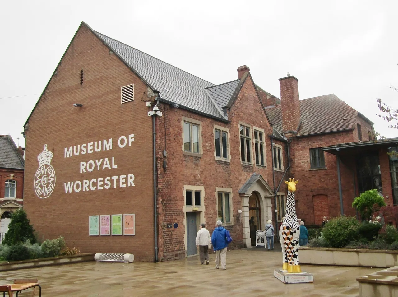 Brick exterior of the Museum of Royal Worcester with its name on the wall