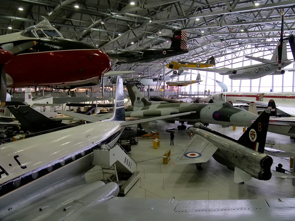 Historic aircraft displayed together inside the AirSpace hangar at IWM Duxford