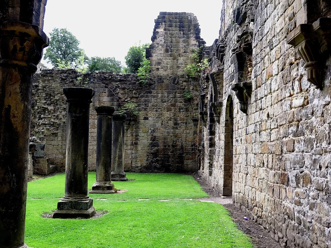 Stone columns and roofless monastic ruins at Kirkstall Abbey