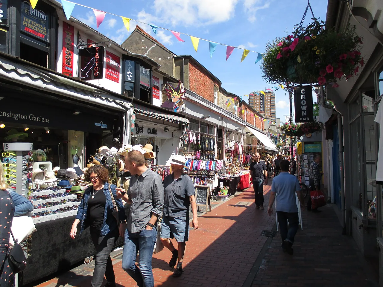 Shops, bunting and pedestrians along Kensington Gardens in North Laine