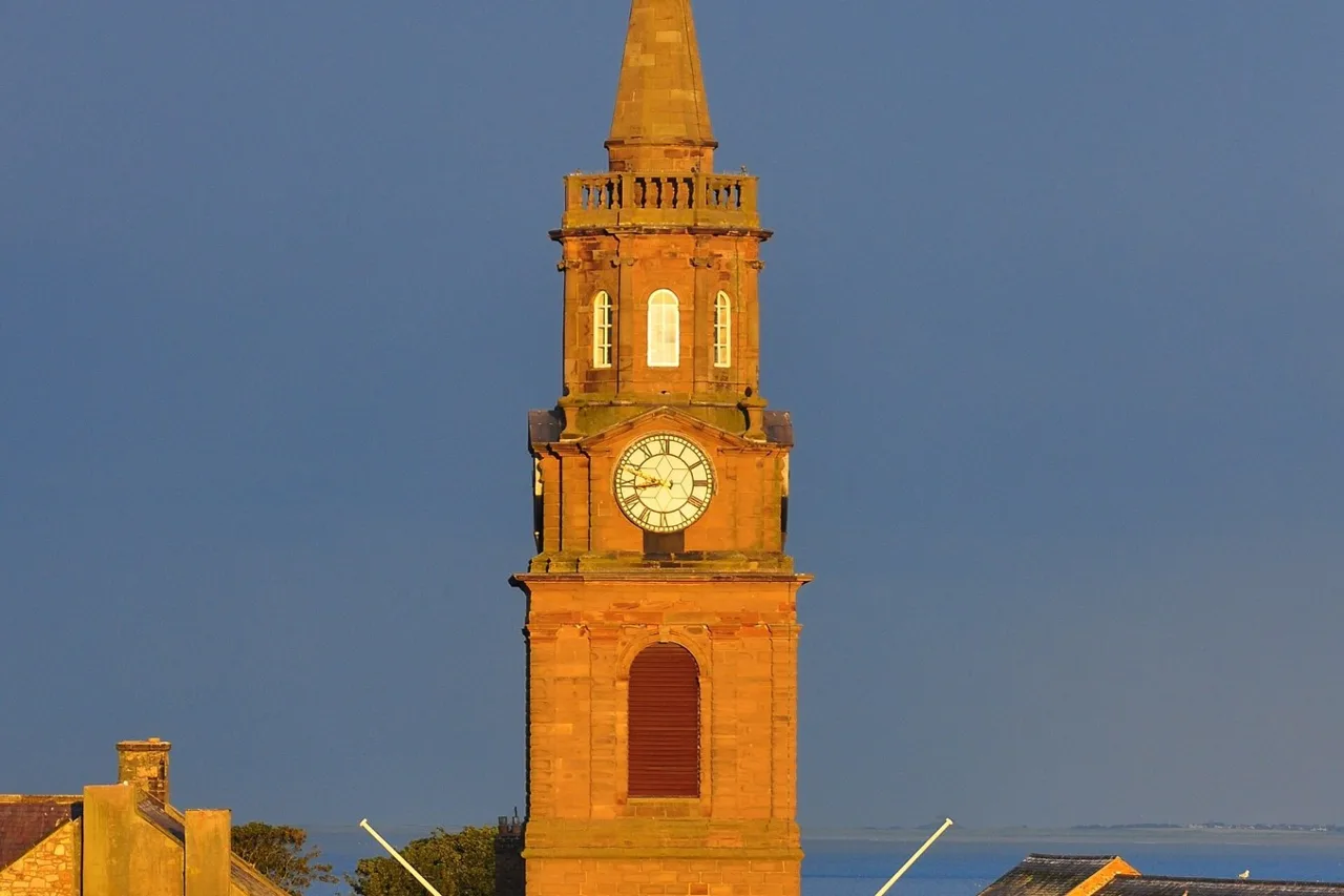 Clock-tower detail of Berwick Town Hall in evening light