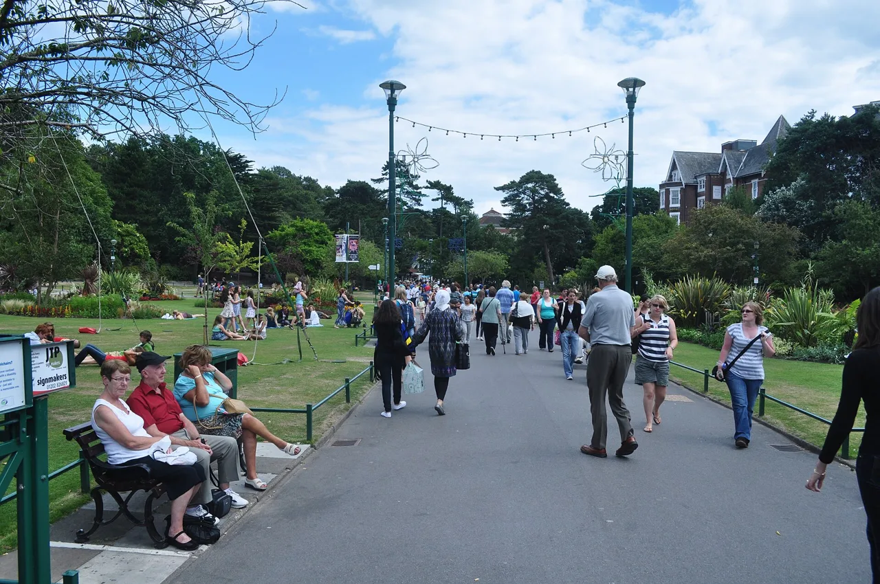 A broad path, flower beds and benches in Bournemouth Lower Gardens