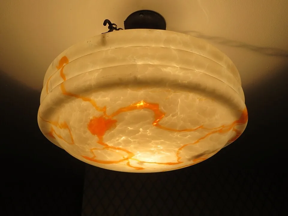 A historic lamp photographed in Stockport Museum