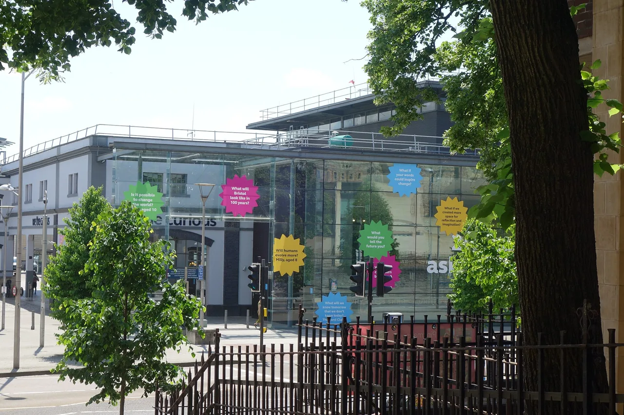 The glazed frontage of We The Curious seen from Trinity Street steps