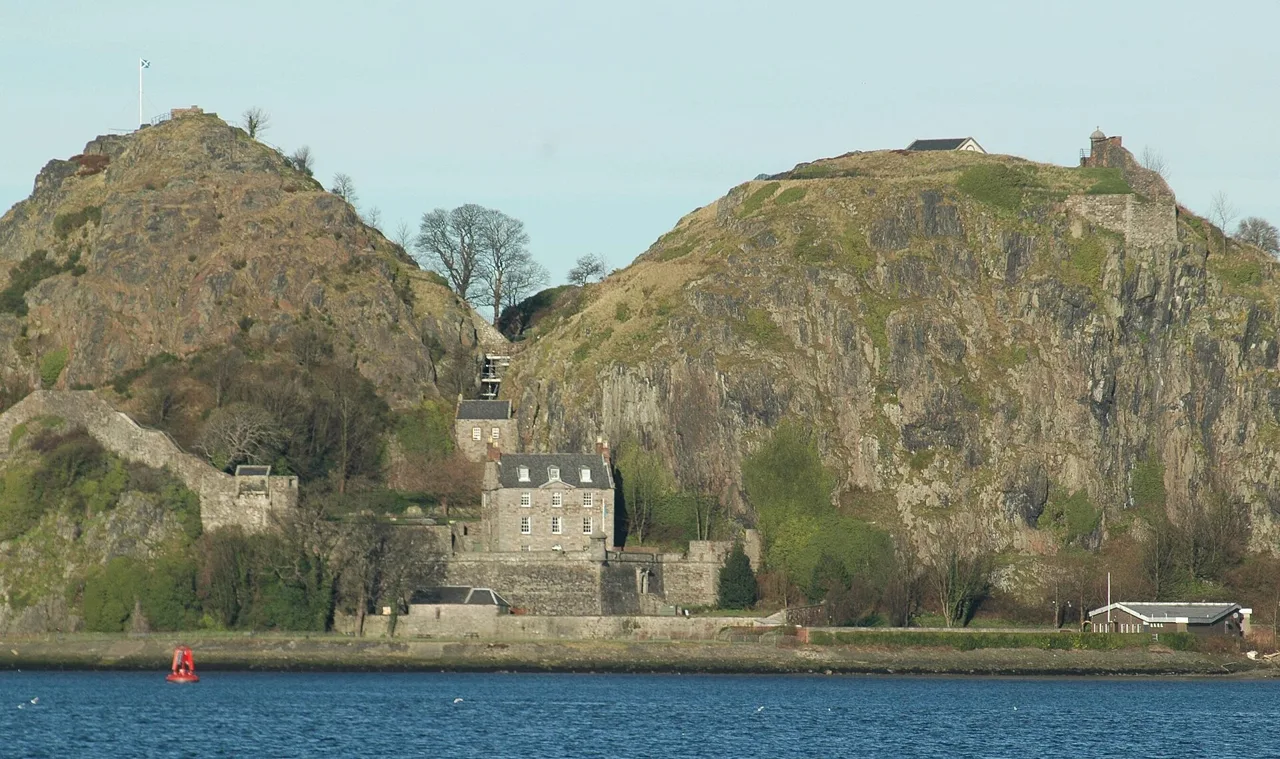 Dumbarton Castle and its twin rocky heights seen across the River Clyde