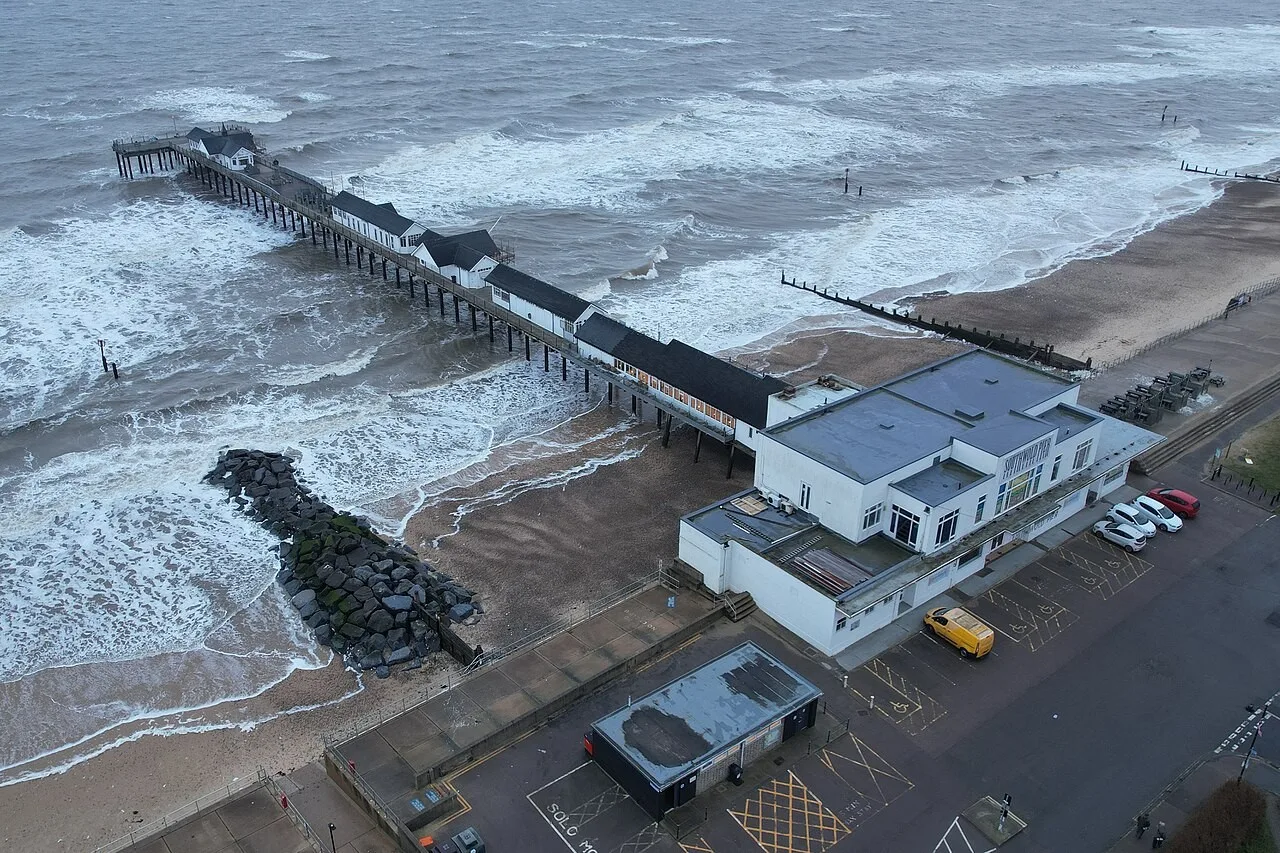 Southwold Pier projects into rough winter seas in an aerial view