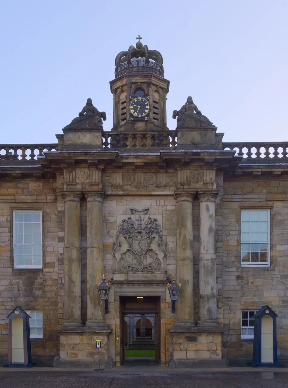 The clock and carved stone entrance of the Palace of Holyroodhouse
