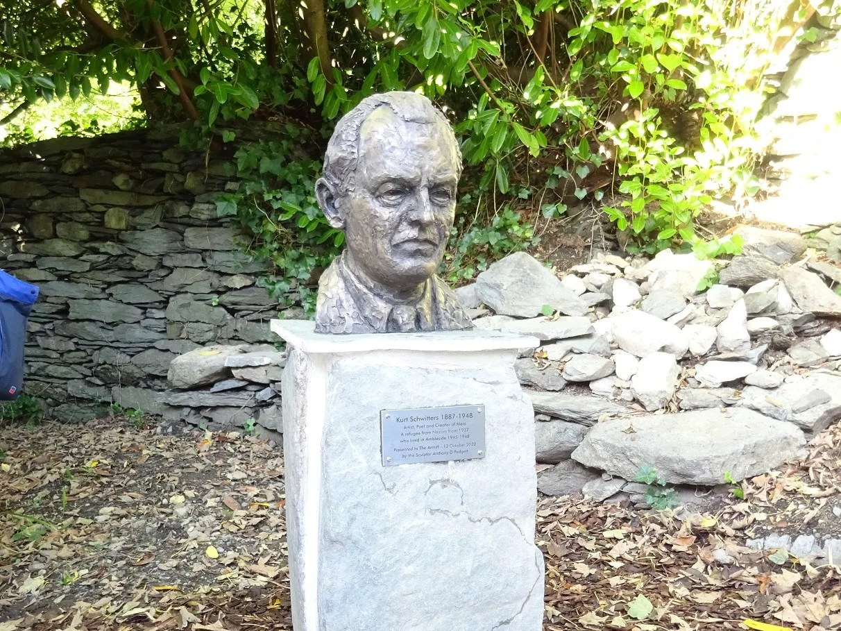 Kurt Schwitters bust by Anthony David Padgett outdoors at the Armitt Museum in 2022