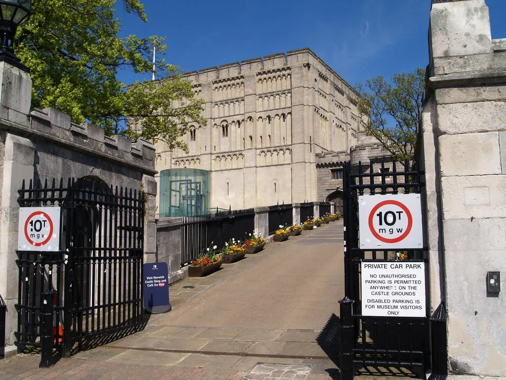 The square Norman keep of Norwich Castle viewed from its approach