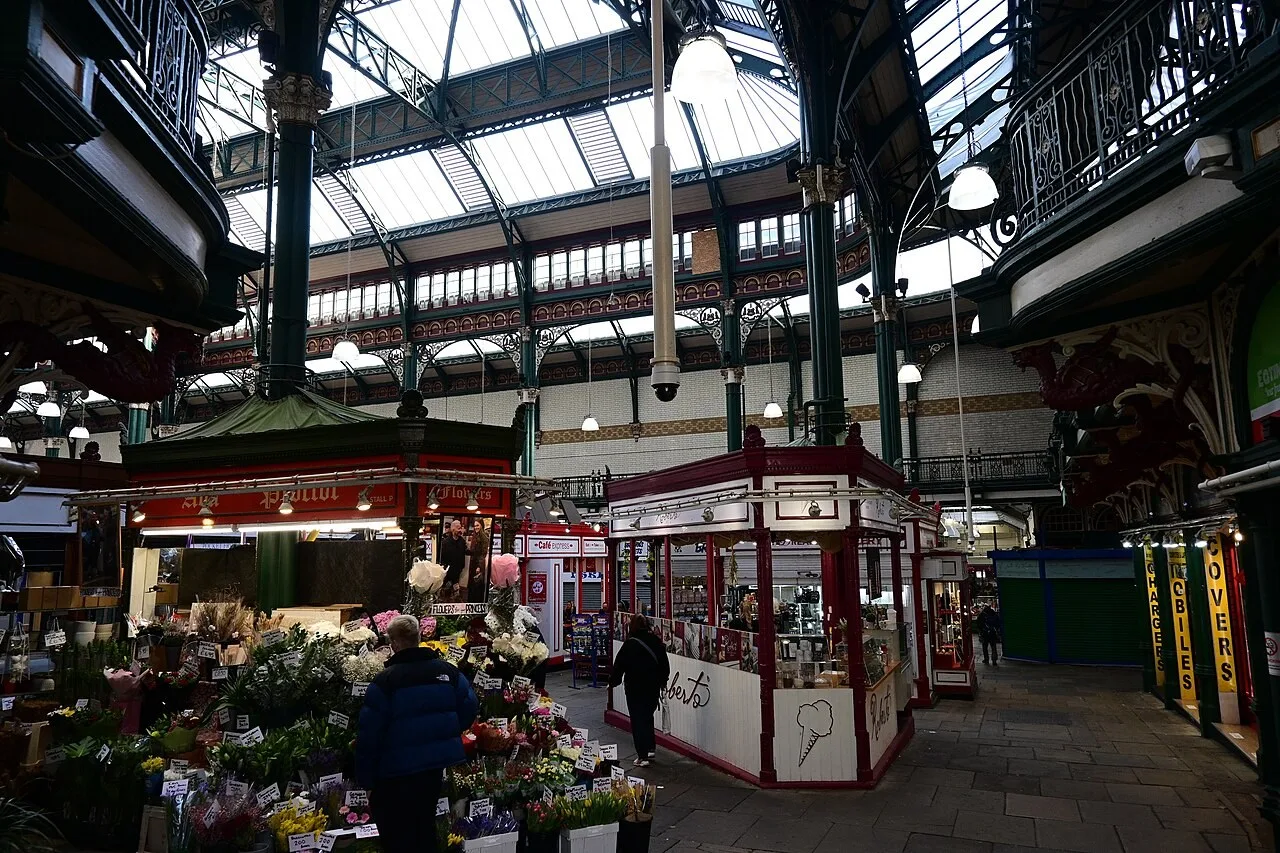 Covered stalls and decorative roof structure inside Leeds Kirkgate Market