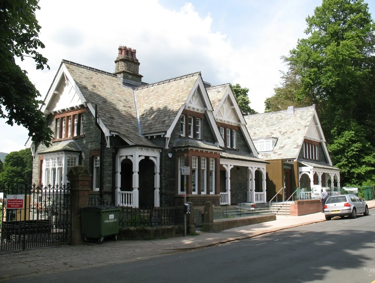 Slate-built Keswick Museum with gabled roofs beside Station Road