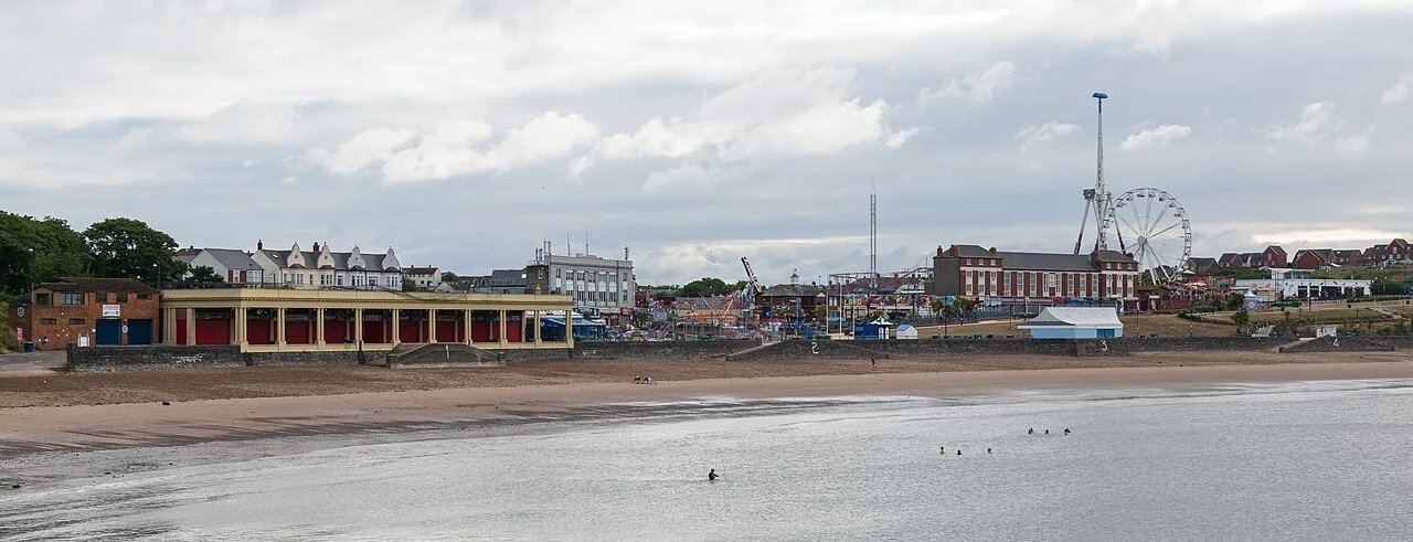 Barry Island beach, pavilion and amusement park seen in July 2023