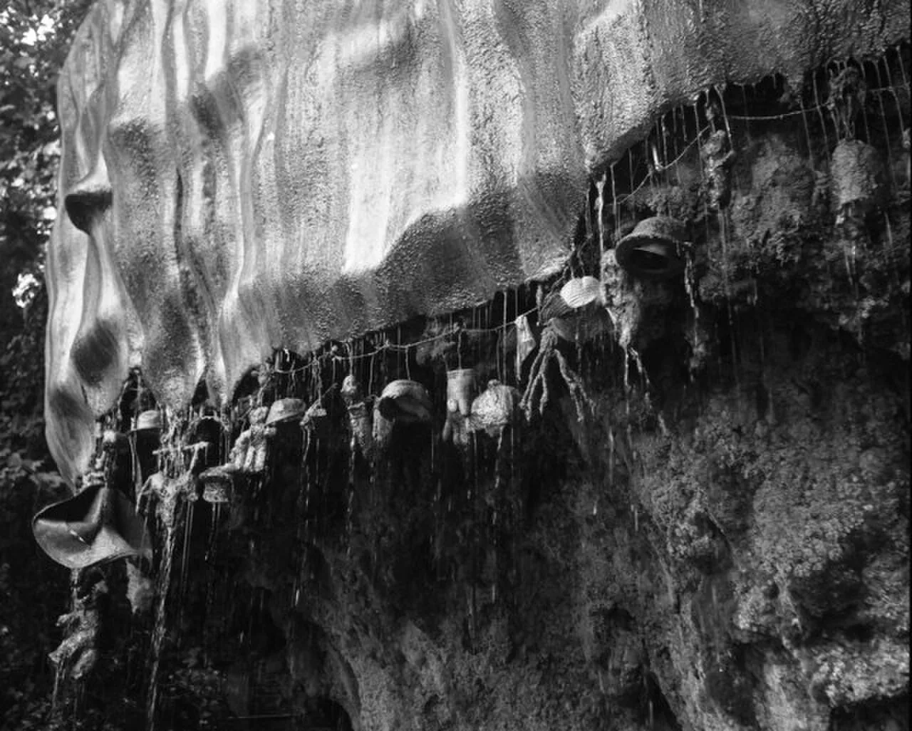 Historical 1974 black-and-white photograph of hanging objects at Knaresborough’s Petrifying Well