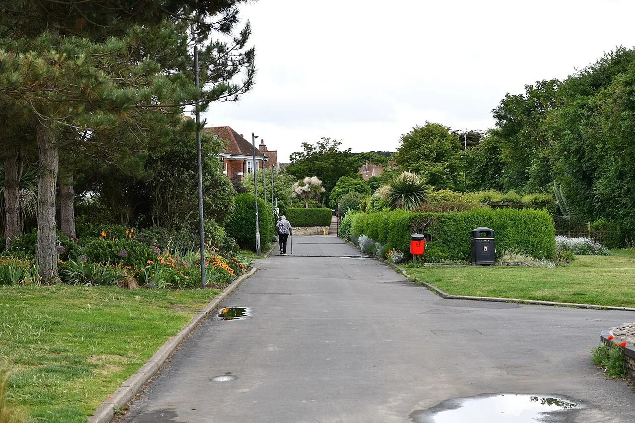Garden path between lawns and trees in North Lodge Park, Cromer