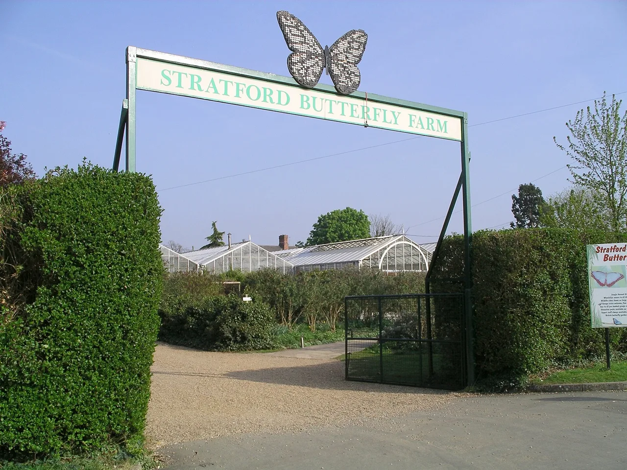 The entrance arch and glasshouses at Stratford Butterfly Farm
