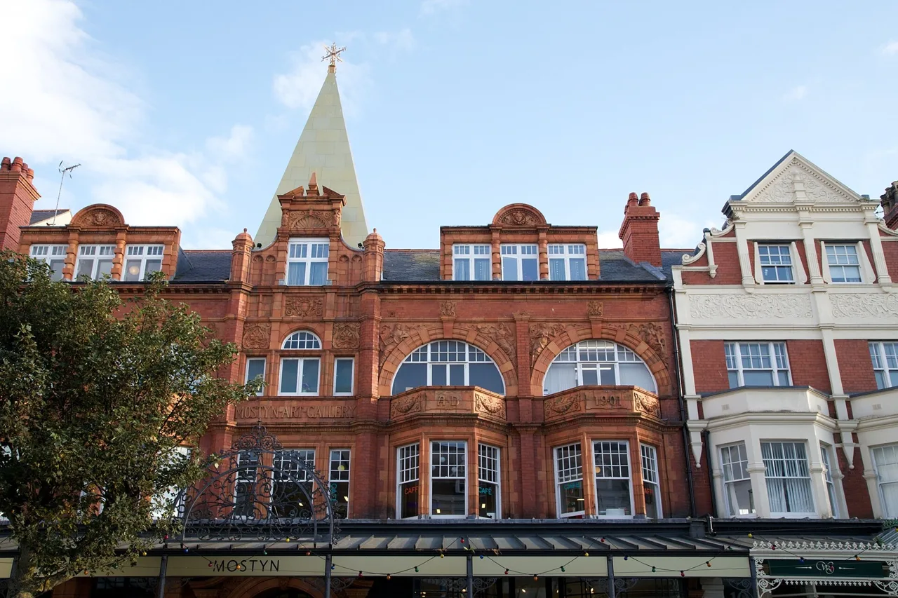 Terracotta frontage and spire of MOSTYN gallery in Llandudno