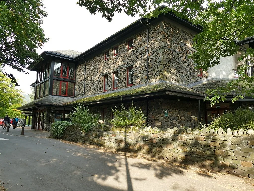 Stone walls and glazed frontage of Theatre by the Lake