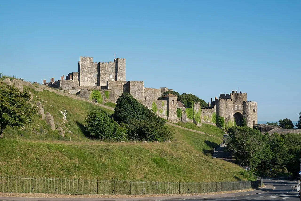 Dover Castle’s keep and stone defences above green slopes